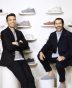 Founders of Allbirds posing with their sustainable footwear collection on display, showcasing eco-friendly shoe options for conscious consumers.